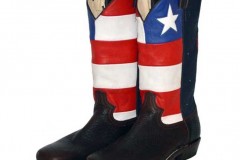 Cowboy boot with red and white stripes and an inlaid star on a blue background