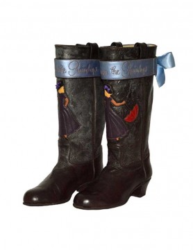 "Raindrops" Brown flat top boots with girl holding umbrella and dancing in the rain.